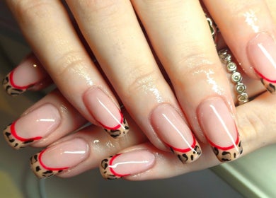 Stylish leopard French tip nails at O'Nails, Newry, Northern Ireland, GB. Elegant and fashionable nail design.