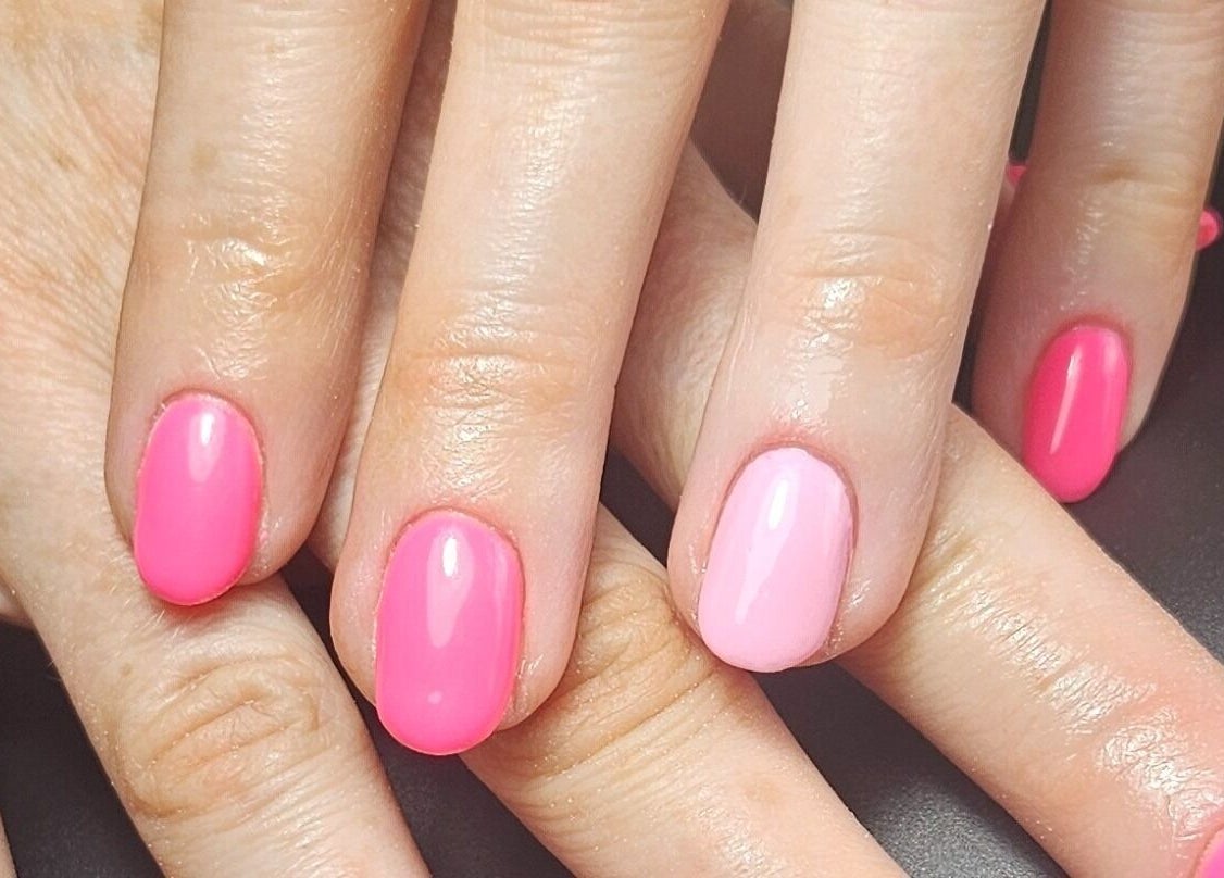 Pink manicure at O'Nails, Newry, Northern Ireland, GB, displaying glossy polished nails.