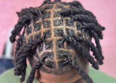 Intricate twist hairstyle showcased at Getrightwjessy, Decatur, Georgia, US for a stunning look.