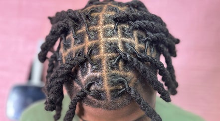 Intricate twist hairstyle showcased at Getrightwjessy, Decatur, Georgia, US for a stunning look.