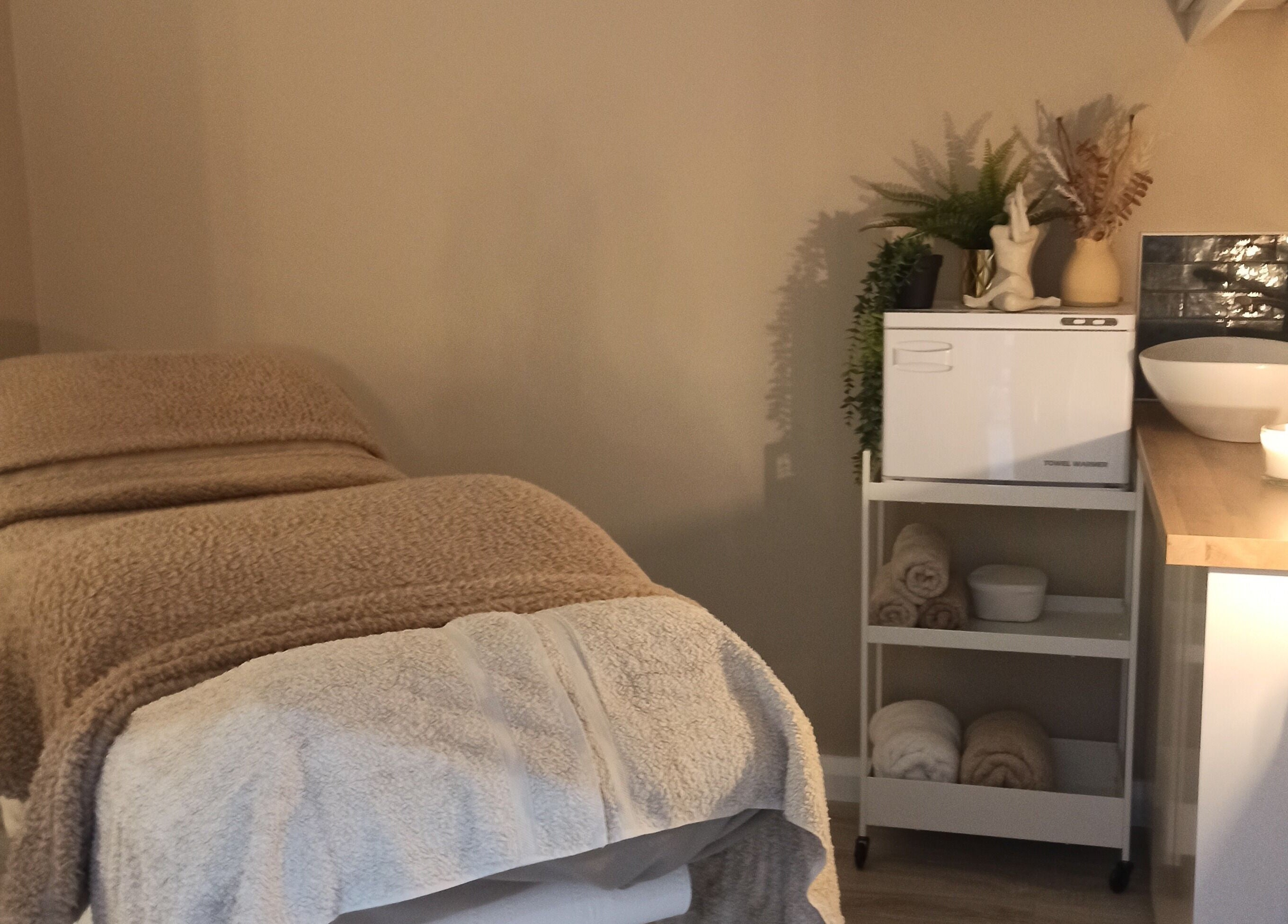 Relaxing treatment room at Kalea Holistic Therapies, Omagh, Northern Ireland, GB, with massage table and calming decor.