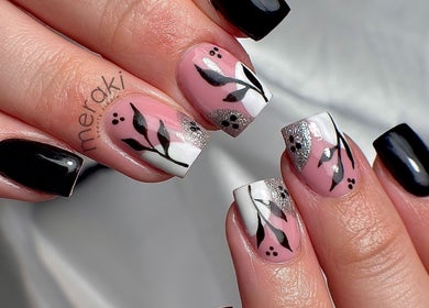Elegant nail art at Meraki Beauty Studio, Liverpool, England, GB. Black and pink floral designs.