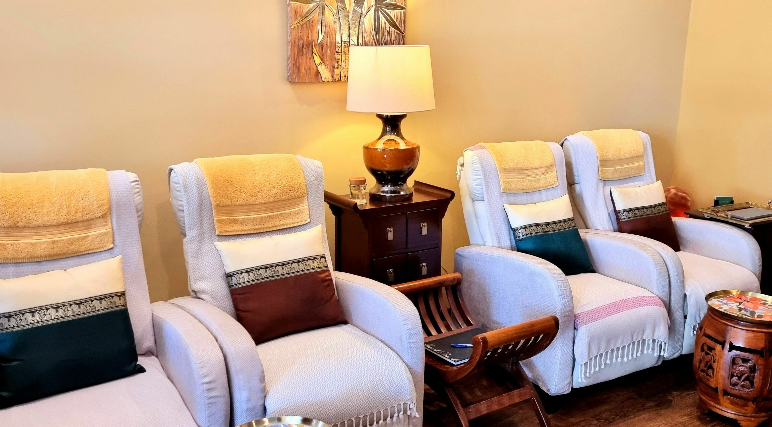 Comfortable spa chairs at Natural Palm Day Spa, Cairns City, Queensland, AU offering a serene ambiance.