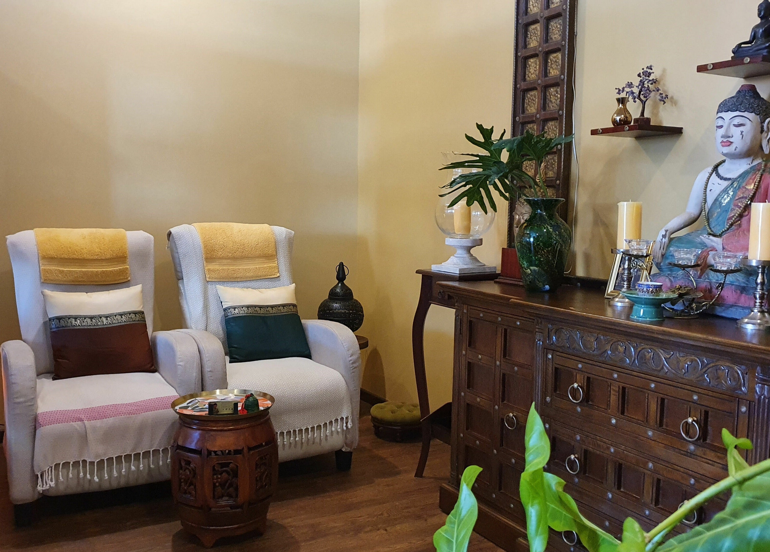 Tranquil seating at Natural Palm Day Spa, Cairns City, Queensland, AU with elegant decor and soothing lighting.