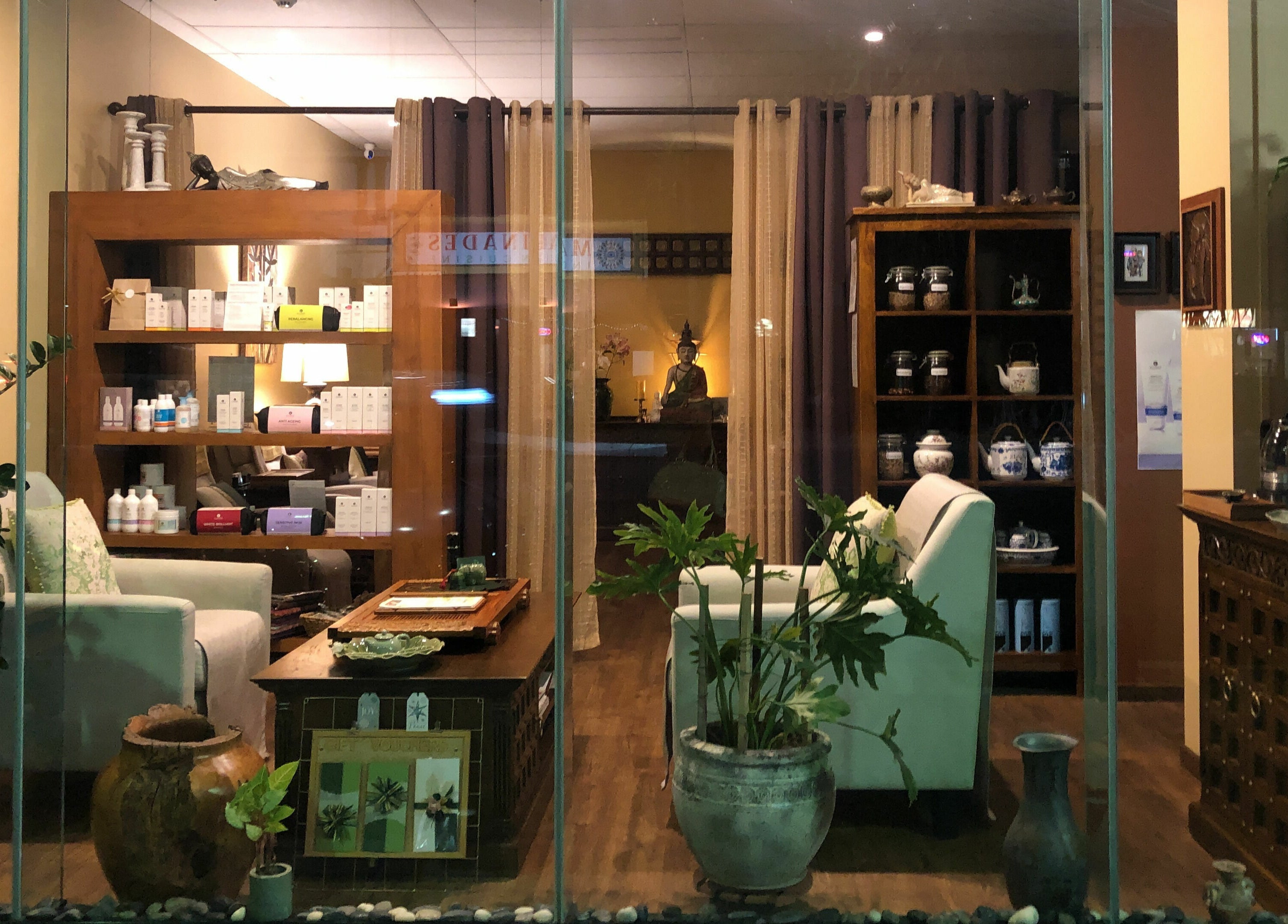 Interior of Natural Palm Day Spa showcasing serene ambiance and decor in Cairns City, Queensland, AU.