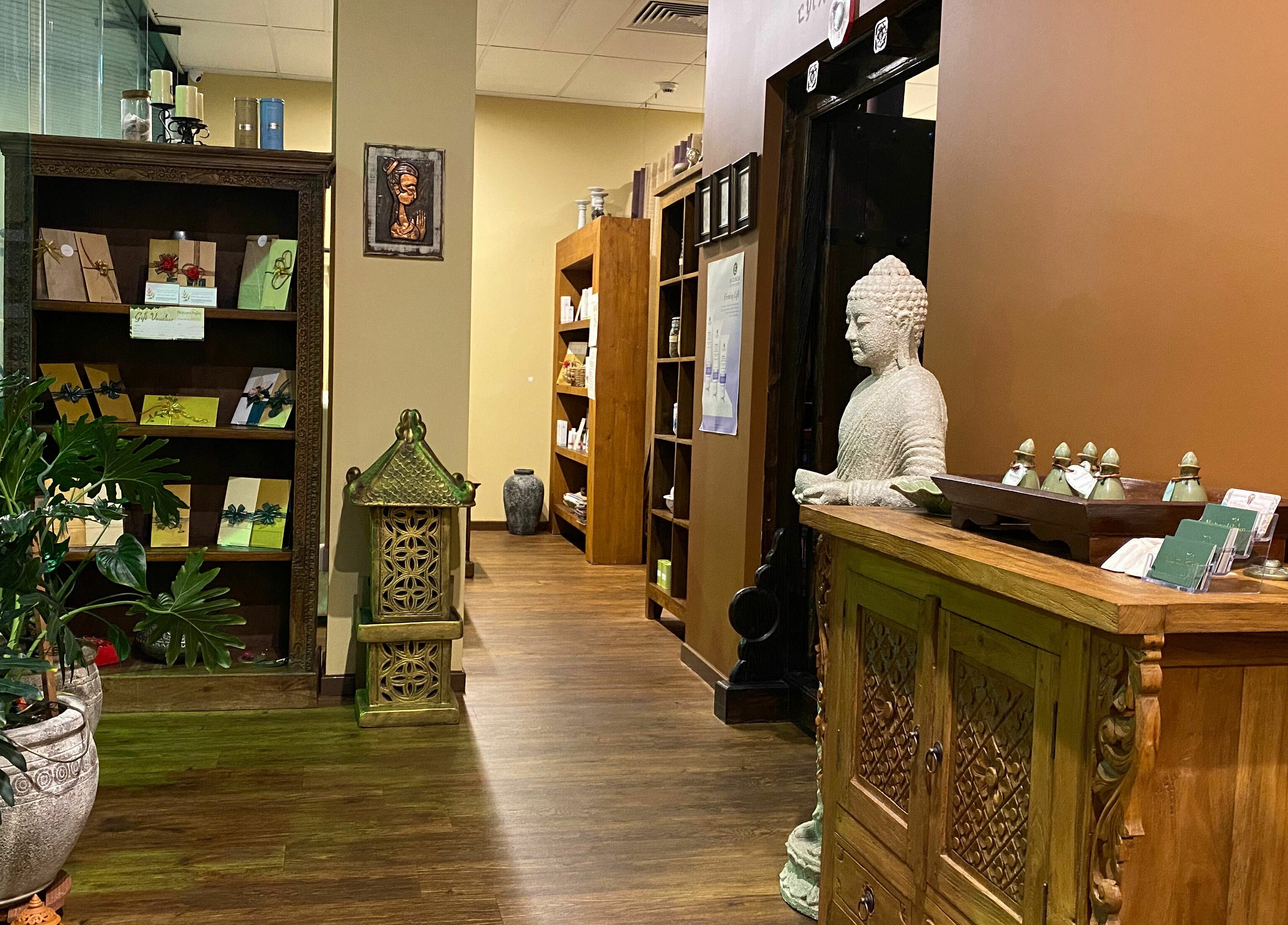 Welcome area of Natural Palm Day Spa in Cairns City, Queensland, AU with calming decor and a Buddha statue.