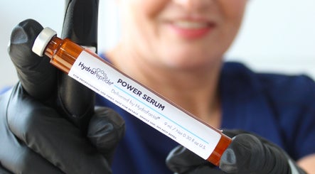 A professional holds HydroPeptide Power Serum at The Skin Bar and Body Boutique LLC in Johnson City, Tennessee, US.