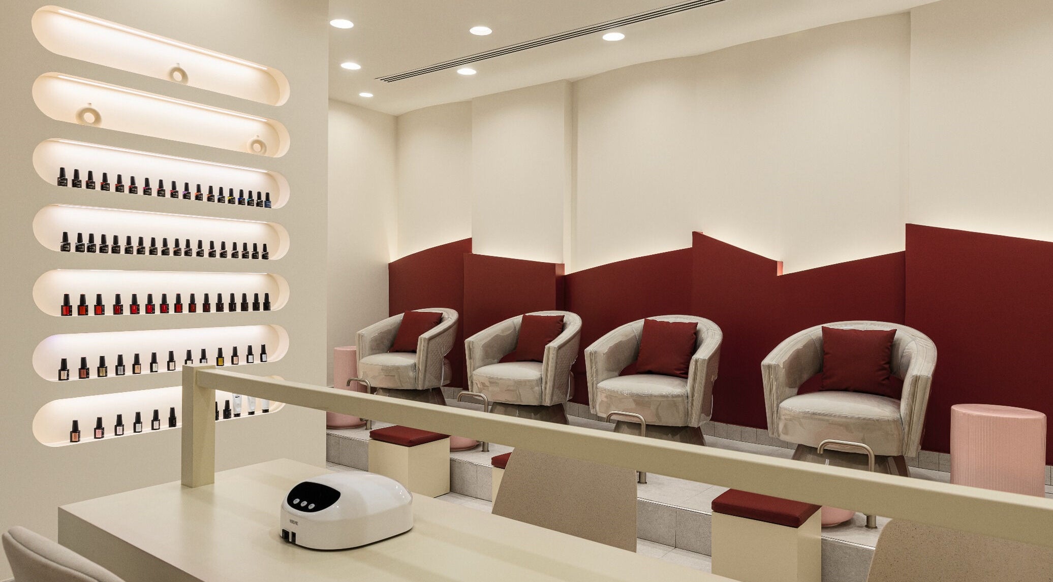 Chic nail care area at Glamaura Beauty Salon, Dubai, Dubai, AE, showcasing rows of vibrant nail polish.