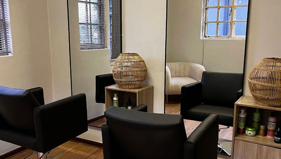 Modern salon seating with mirrors at Vanity Beauty Bar, Pretoria, Gauteng, ZA for a luxurious experience.