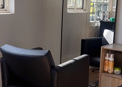 Modern salon chair and products at Vanity Beauty Bar, Pretoria, Gauteng, ZA, highlighting a serene atmosphere.