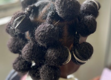 Intricate hairstyle with twists at Vanity Beauty Bar, Pretoria, Gauteng, ZA, showcasing detailed hair artistry.