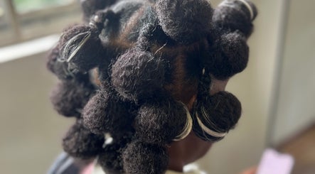 Intricate hairstyle with twists at Vanity Beauty Bar, Pretoria, Gauteng, ZA, showcasing detailed hair artistry.