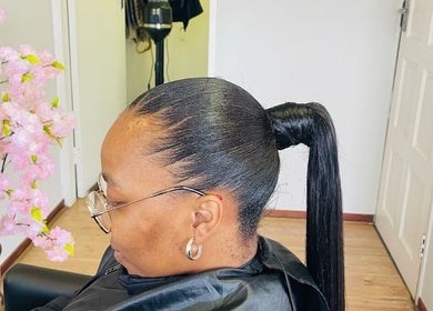 Stylish ponytail hairstyle at Vanity Beauty Bar, Pretoria, Gauteng, ZA, showcasing sleek elegance.