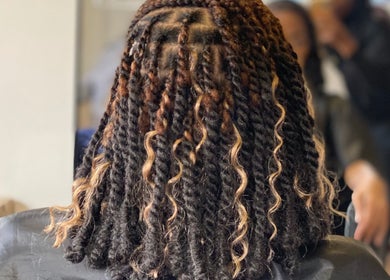 Intricate twisted hairstyle showcased at Vanity Beauty Bar in Pretoria, Gauteng, ZA.
