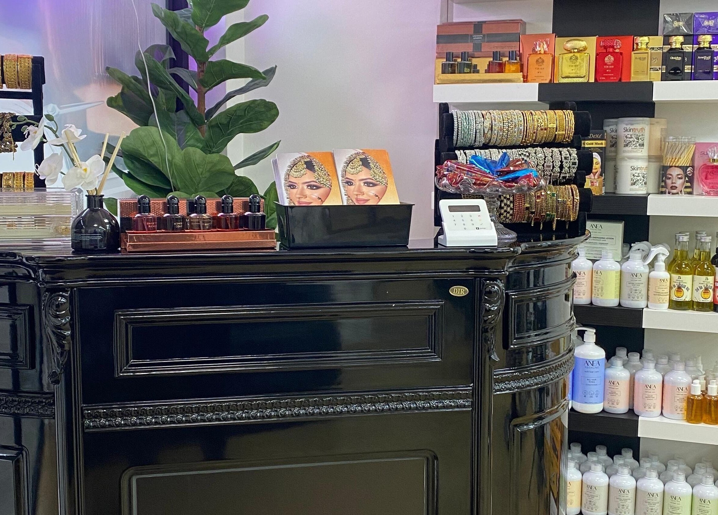 A stylish counter with beauty products at MS Beauty Salon, Luton, England, GB showcasing elegant jewelry and cosmetics.
