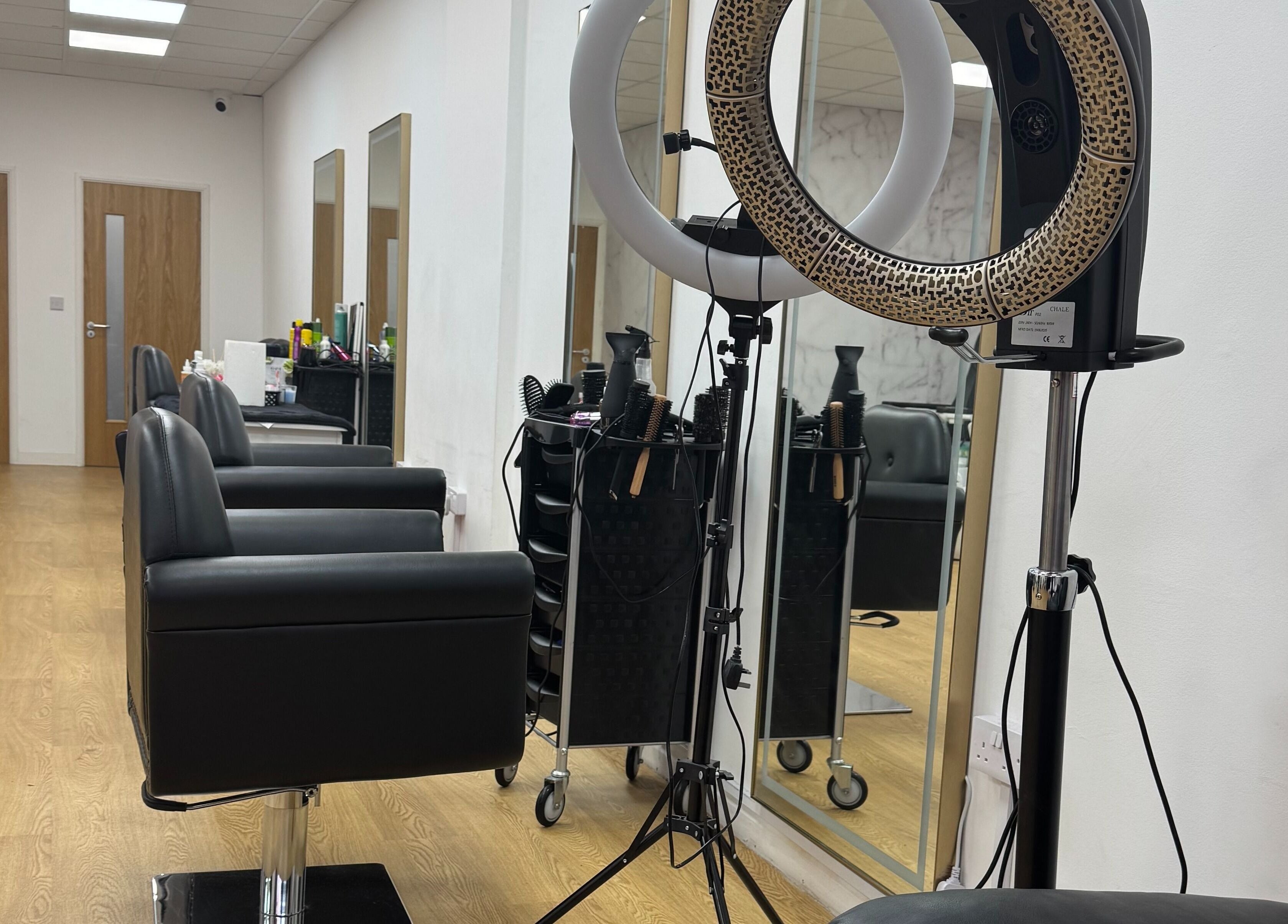 Modern interior of MS Beauty Salon, Luton, England, GB featuring sleek salon chairs and professional styling tools.
