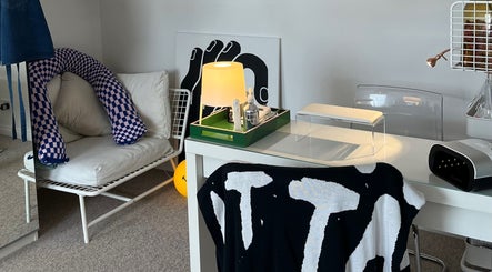Relaxing corner at Samanails, Broughshane, Northern Ireland, GB with stylish decor, cozy seating, and ambient lighting.