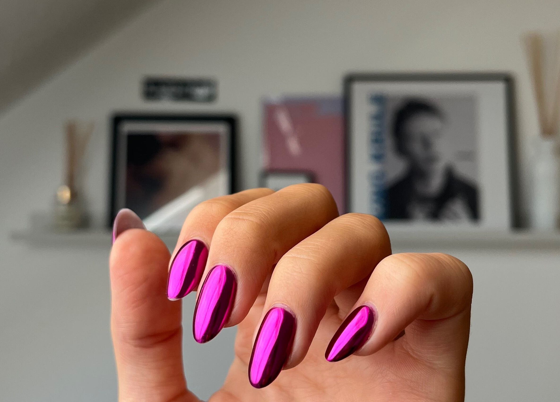 Glossy magenta nails at Samanails, Broughshane, Northern Ireland, GB create a stunning and stylish look.