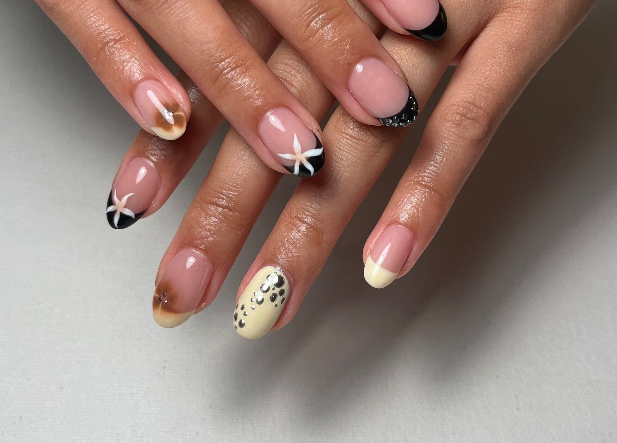 Elegant nail art at Samanails, Broughshane, Northern Ireland, GB, showcasing creative designs and intricate details.