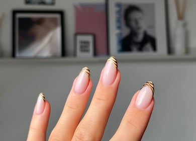 Elegant manicured nails with gold accents at Samanails, Broughshane, Northern Ireland, GB.