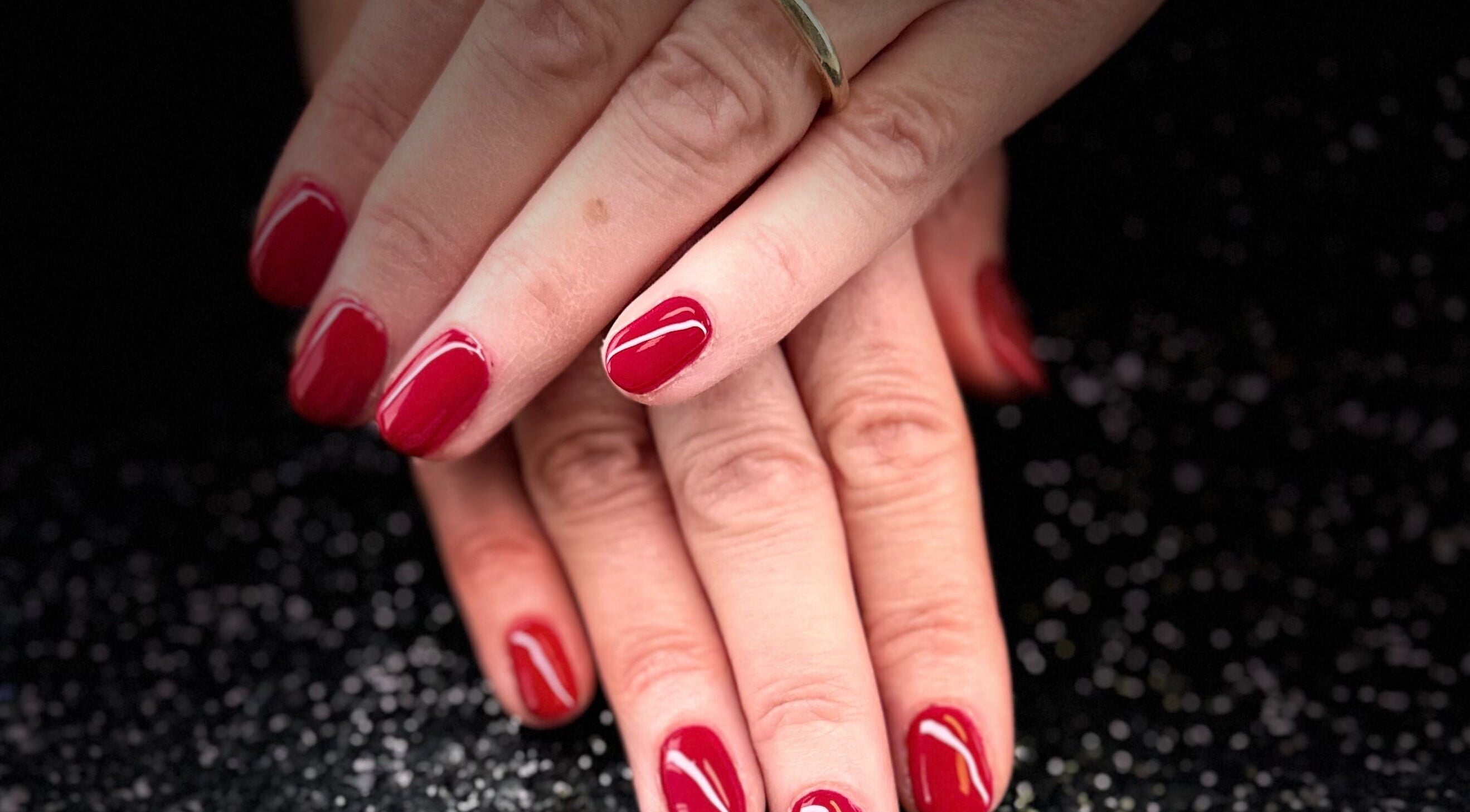 Elegant red nails at Nazia Sandhu - Permanent Makeup and Nails in Wokingham, England, GB.