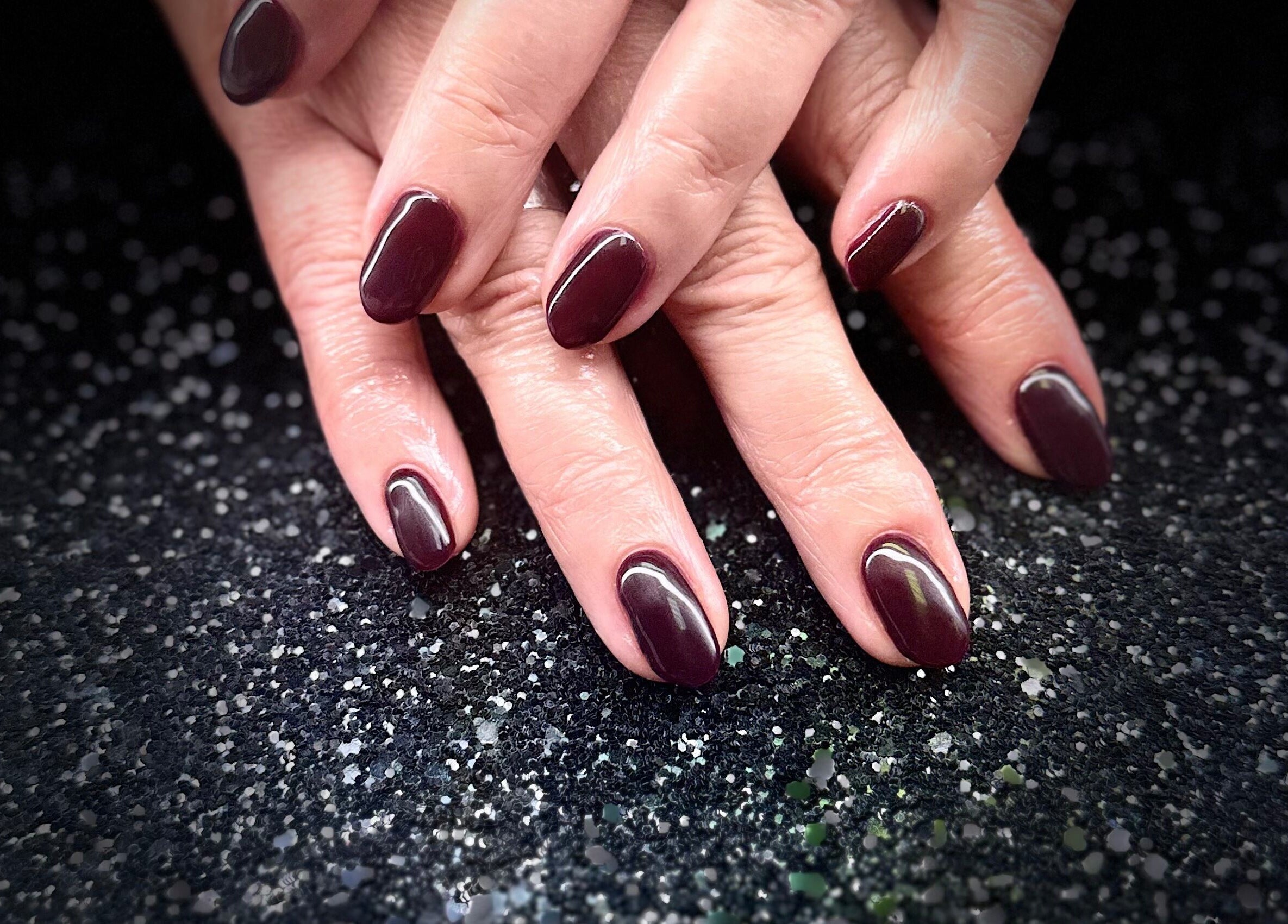 Elegant maroon manicure at Nazia Sandhu - Permanent Makeup and Nails, Wokingham, England, GB.