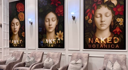 Luxurious seating area at NAKED BOTANICA by THE ART of NAILS Newmarket, Auckland, NZ with artistic floral portraits.