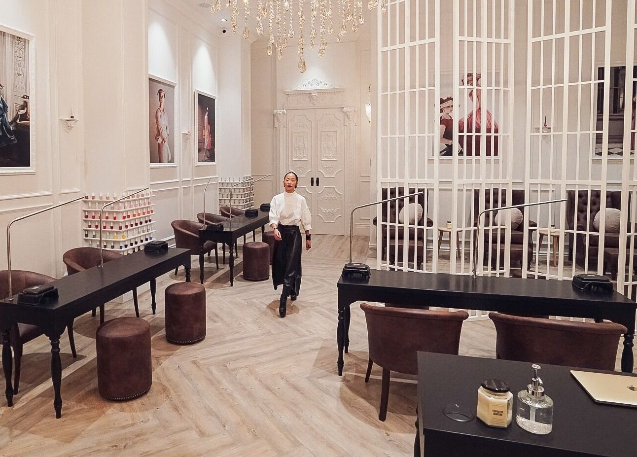 Elegant interior of The Art of Nails Commercial Bay, Auckland, NZ with luxurious seating and decor.