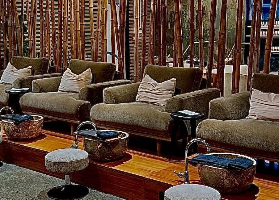 Luxurious pedicure seating at The Art of Nails Albany, Auckland, NZ, with elegant decor and comfortable chairs.