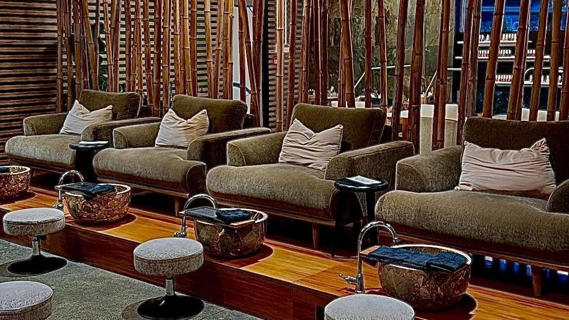 Luxurious pedicure seating at The Art of Nails Albany, Auckland, NZ, with elegant decor and comfortable chairs.