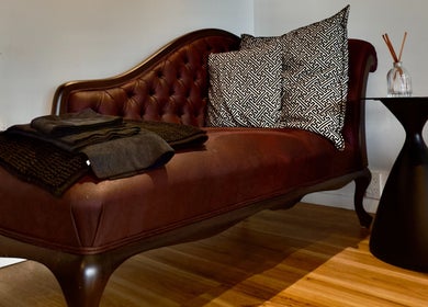 Plush chaise lounge at The Art of Nails Ponsonby, Auckland, Auckland, NZ, offering cozy ambiance.