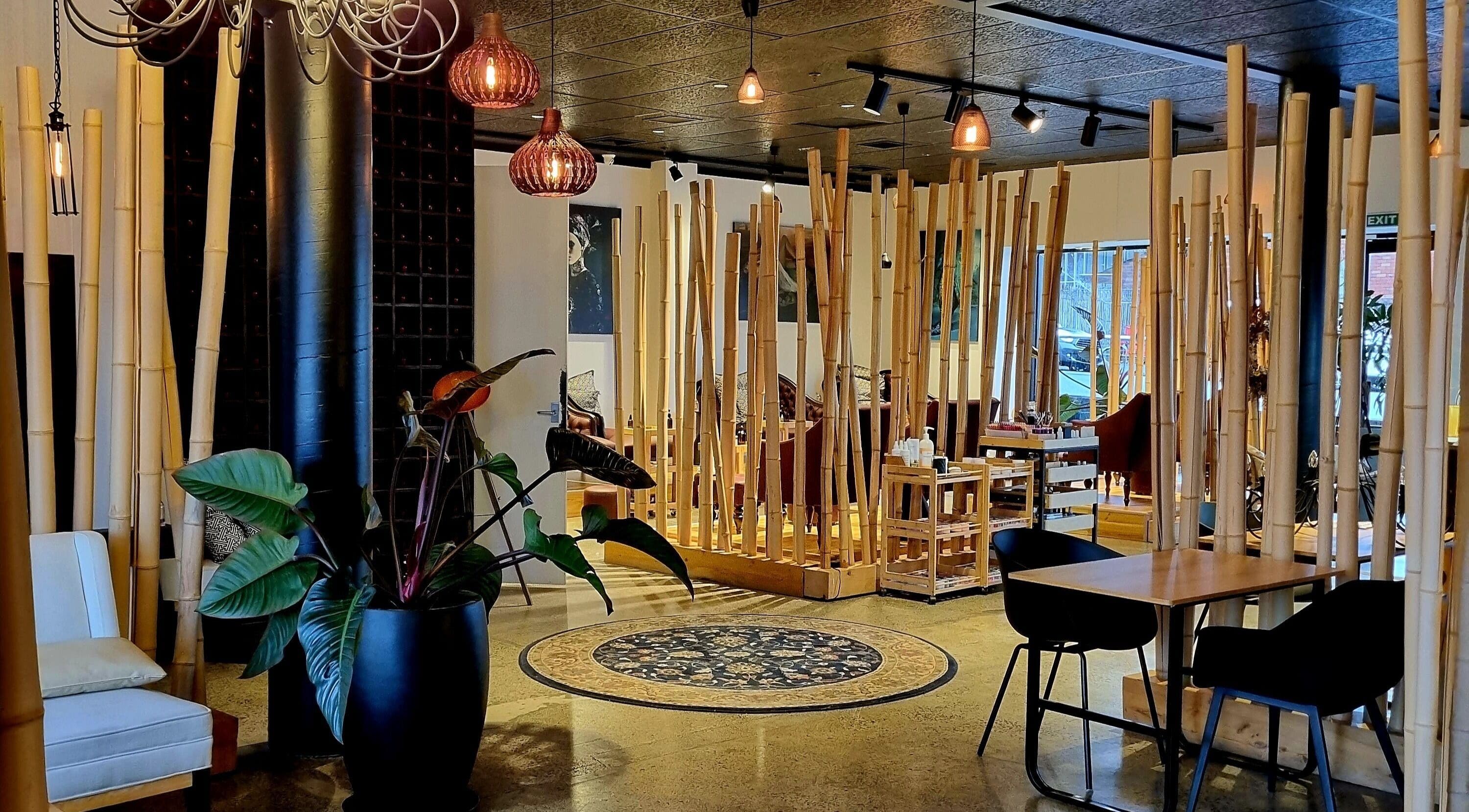 Relaxing lounge at The Art of Nails Ponsonby in Auckland, Auckland, NZ, with bamboo decor and cozy seating.