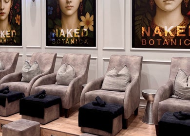 Luxurious seating at Naked Botanica by The Art of Nails Newmarket, Auckland, Auckland, NZ; plush chairs invite relaxation.