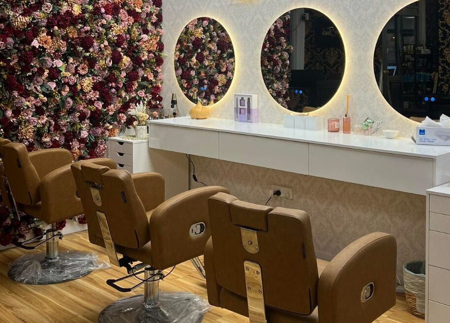 Luxurious salon setup with floral wall at Shine Magic Touch Rototuna, Hamilton, Waikato, NZ.