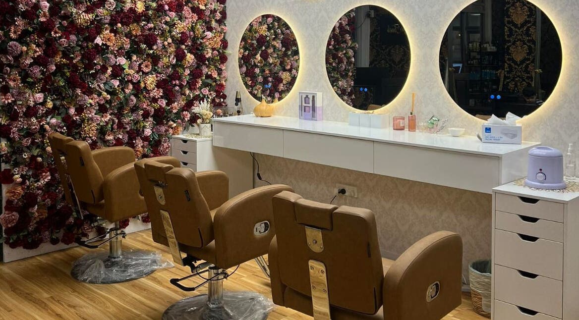 Luxurious salon setup with floral wall at Shine Magic Touch Rototuna, Hamilton, Waikato, NZ.