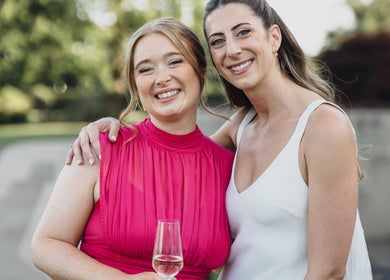 Two smiling women celebrating at By Ange - Bridal & Occasion Makeup Artist, Warrington, England, GB.