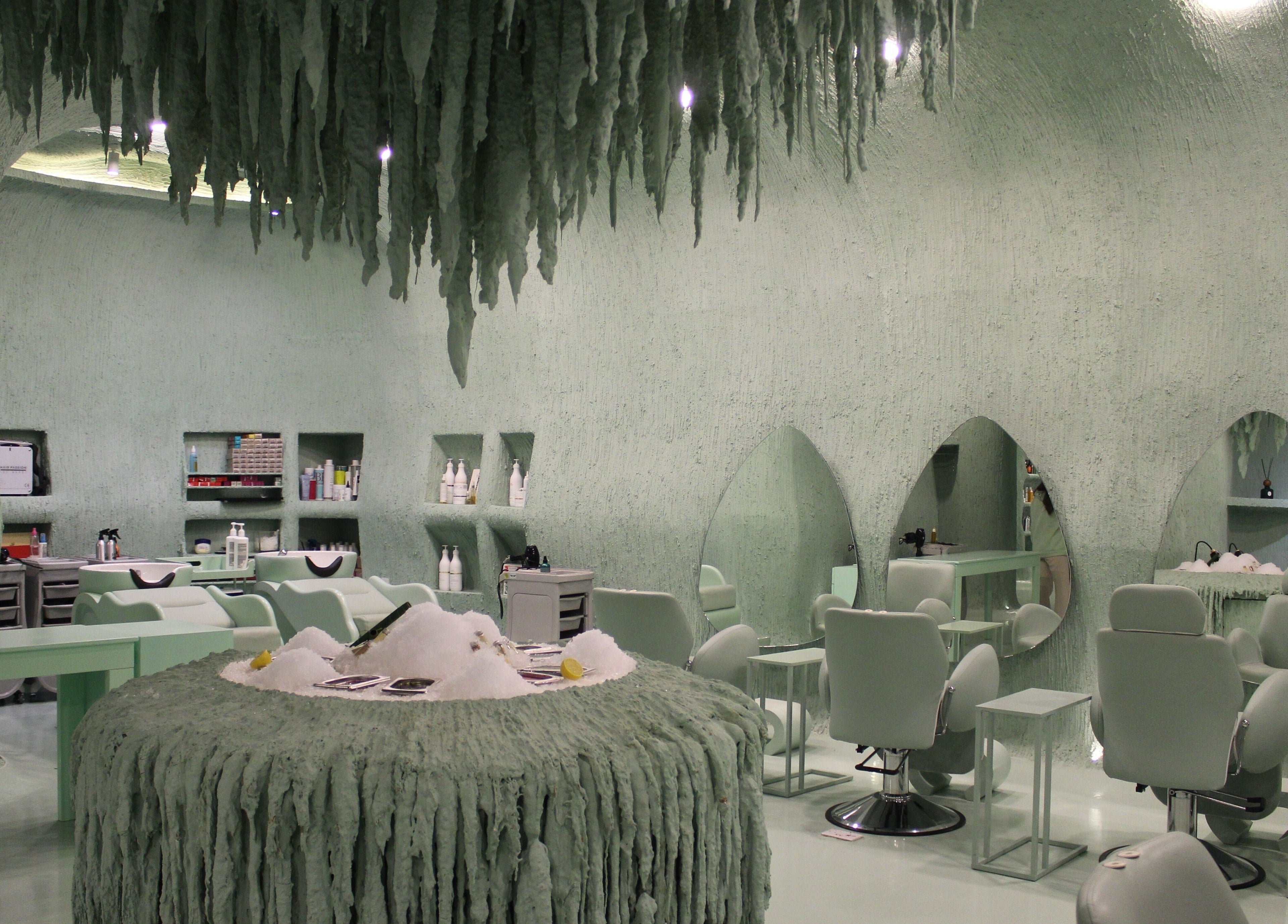 Stylish interior of Hide Beauty Center in Sharjah, AE, featuring modern salon chairs and unique design.