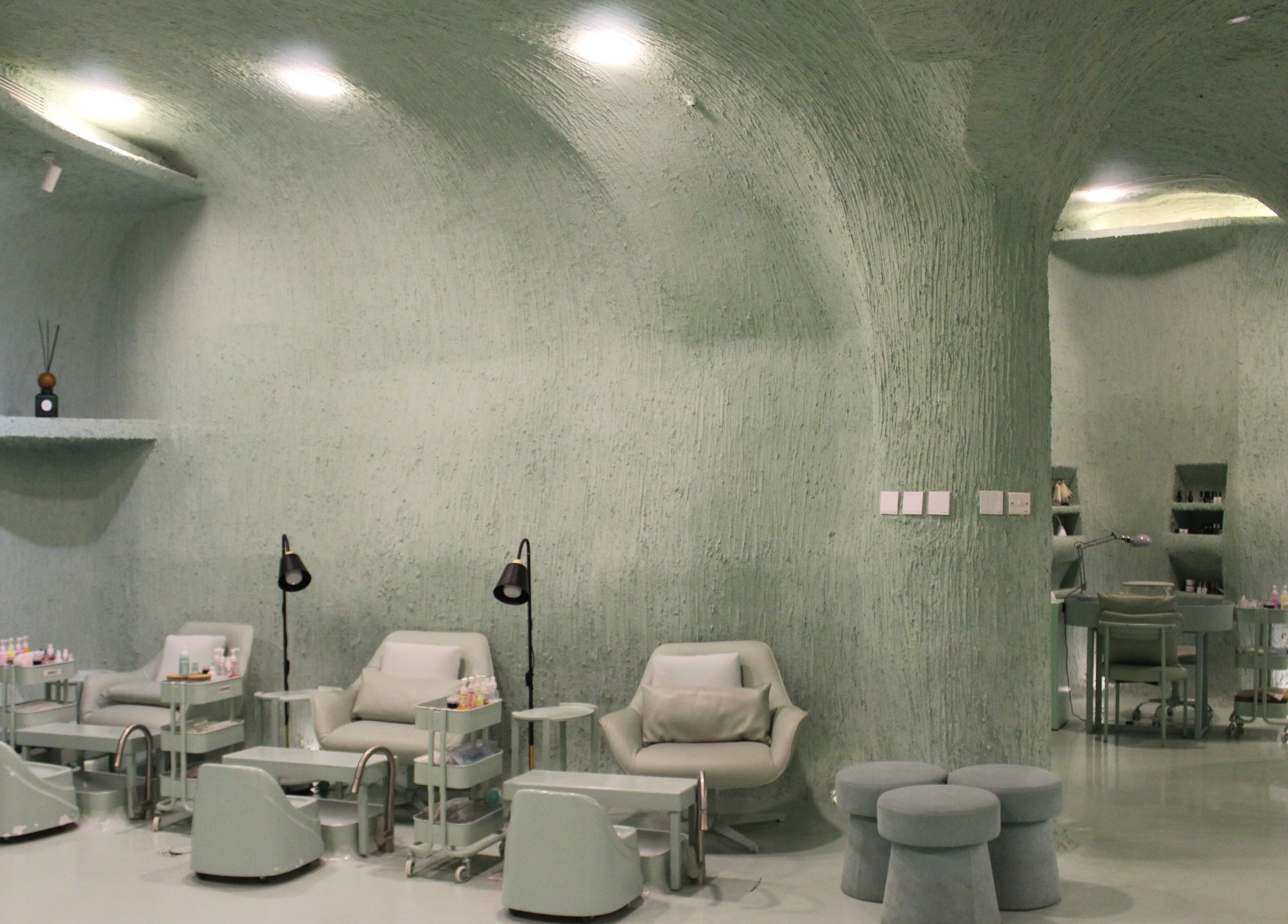 Modern interior of Hide Beauty Center, Sharjah, Sharjah, AE with serene seating and ambient lighting.