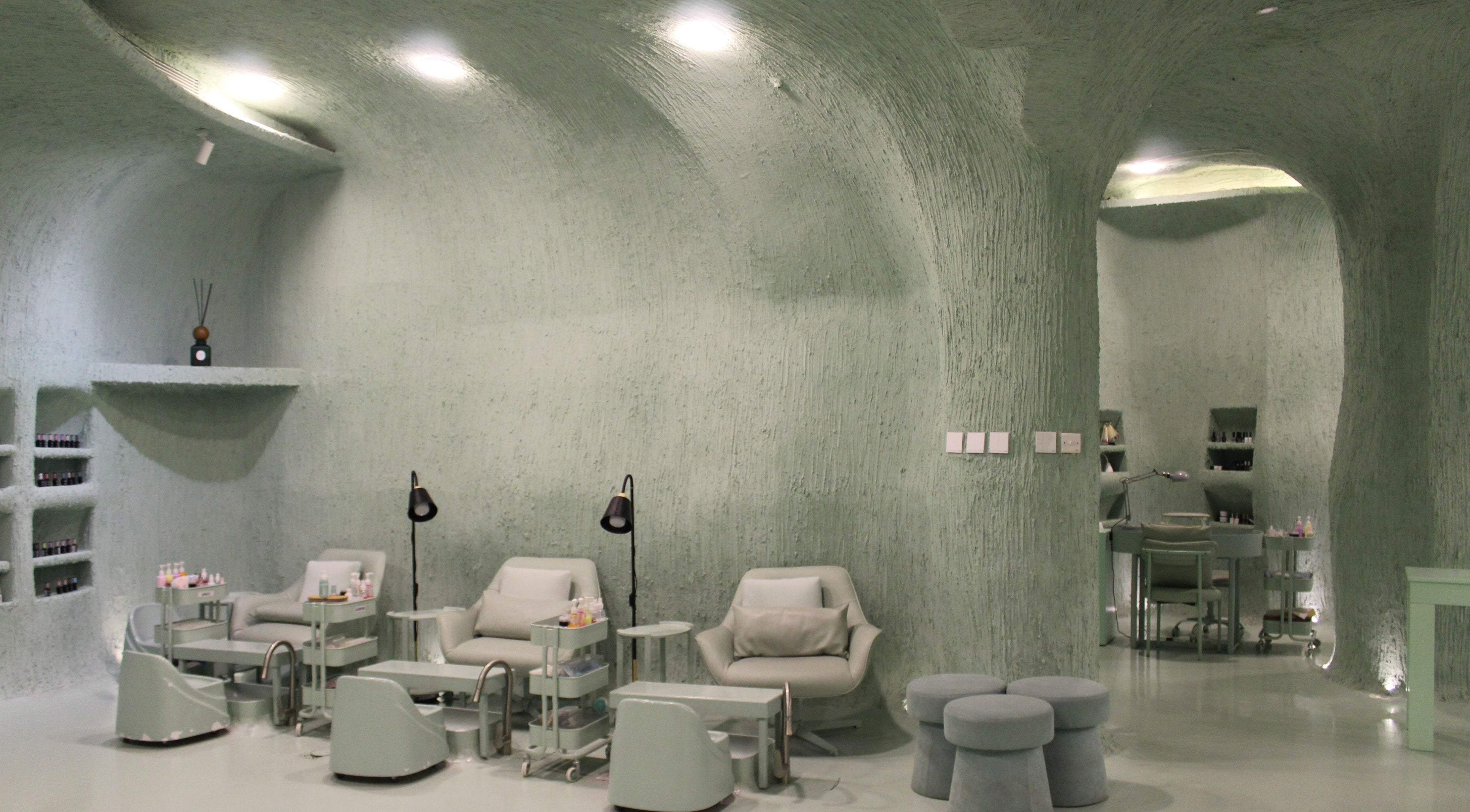 Modern interior of Hide Beauty Center, Sharjah, Sharjah, AE with serene seating and ambient lighting.