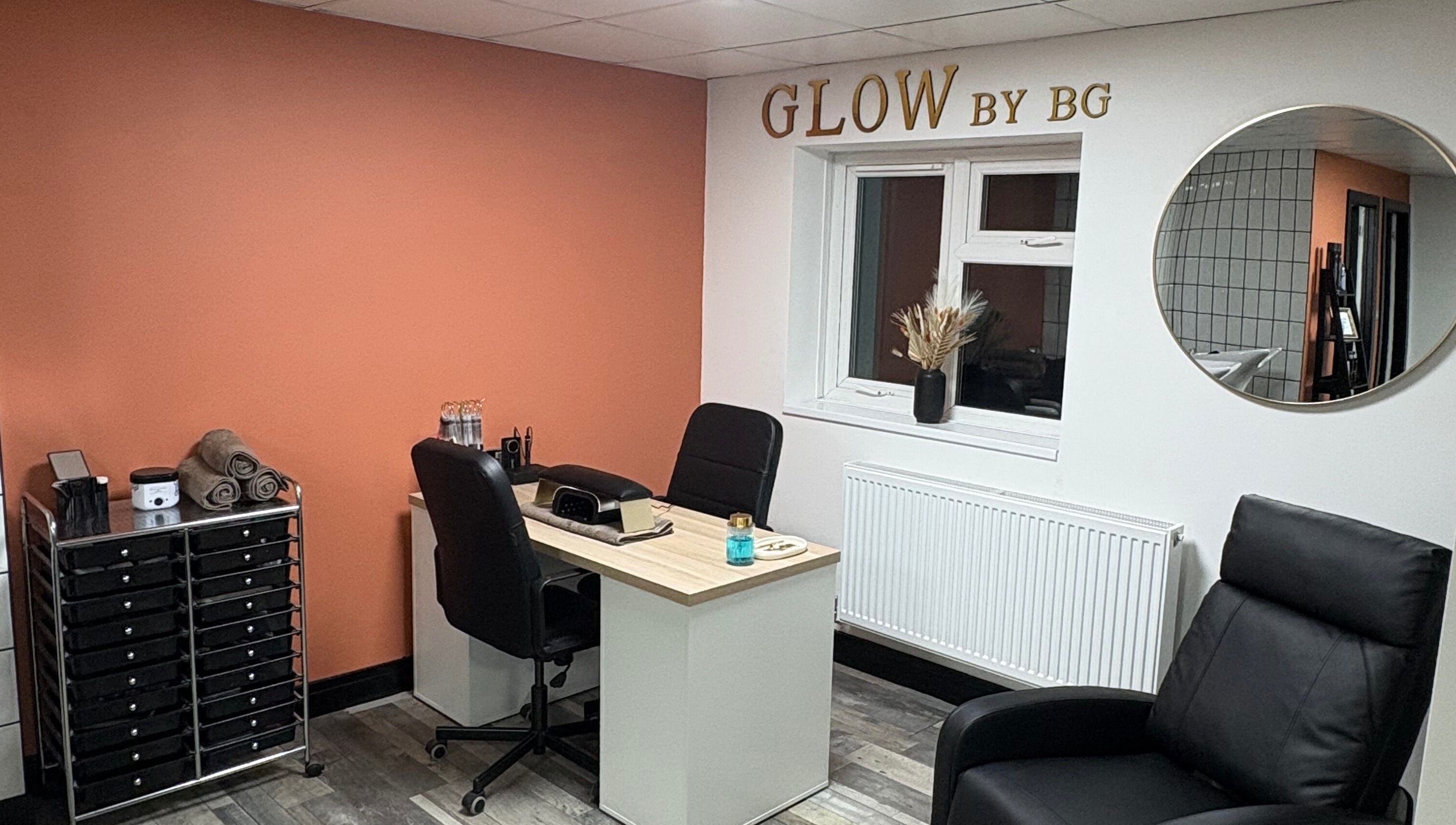 Cozy interior of Glow By BG in Rotherham, England, GB with a stylish desk and modern decor.