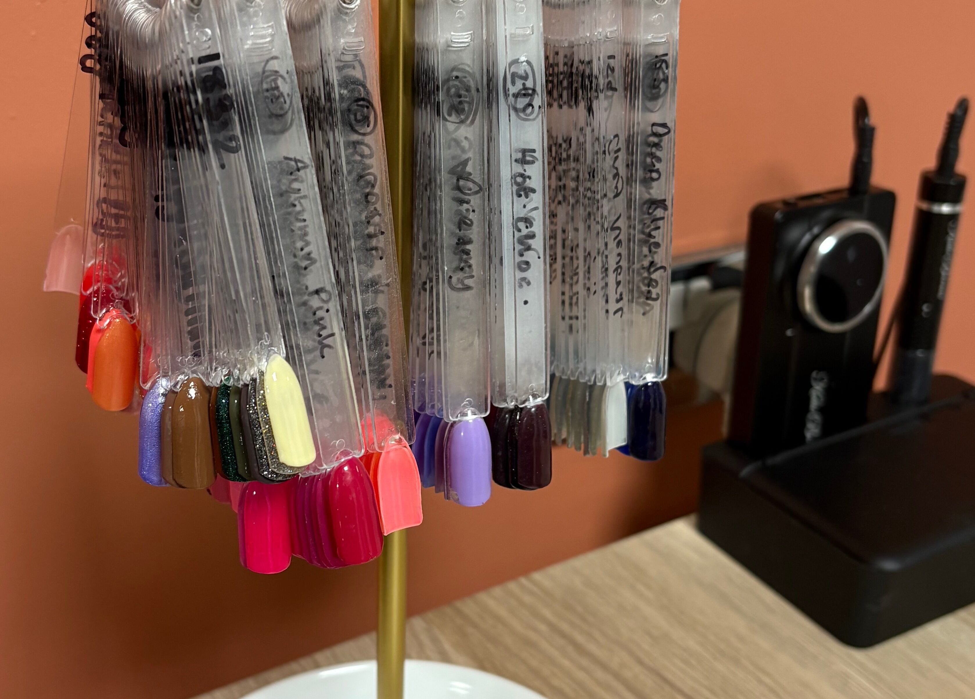 Nail polish color swatch display at Glow By BG, Rotherham, England, GB.