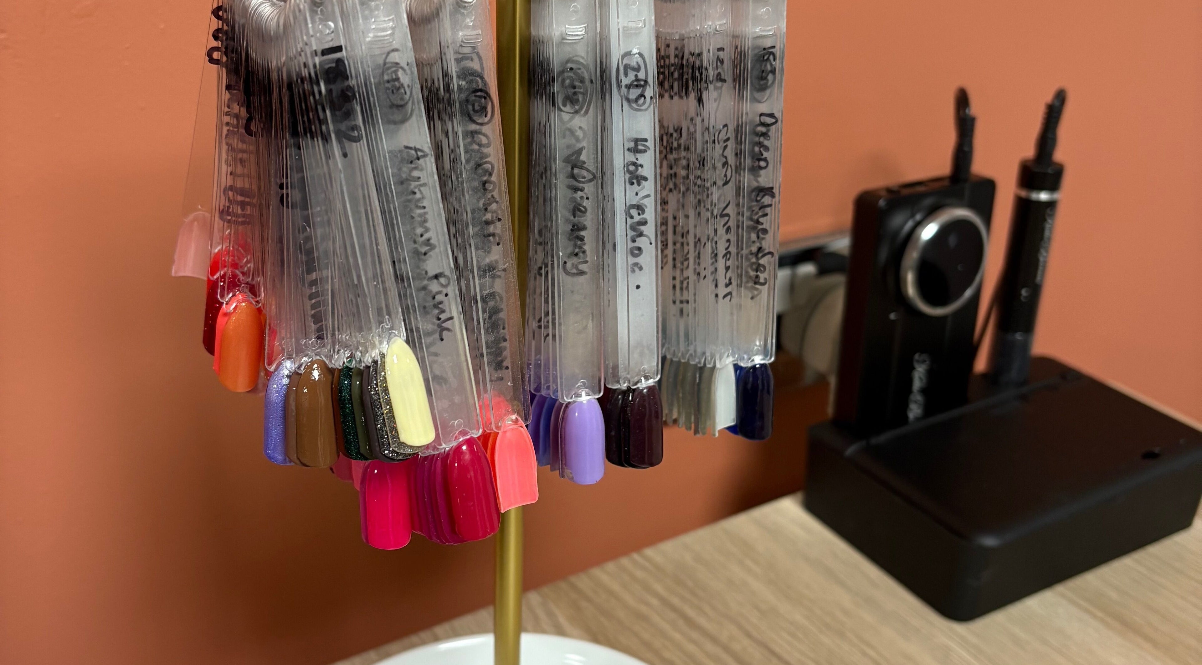 Nail polish color swatch display at Glow By BG, Rotherham, England, GB.