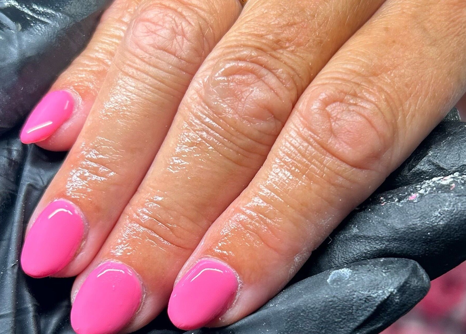 Fresh pink manicure at Glow By BG in Rotherham, England, GB, showcasing vibrant salon nail art.