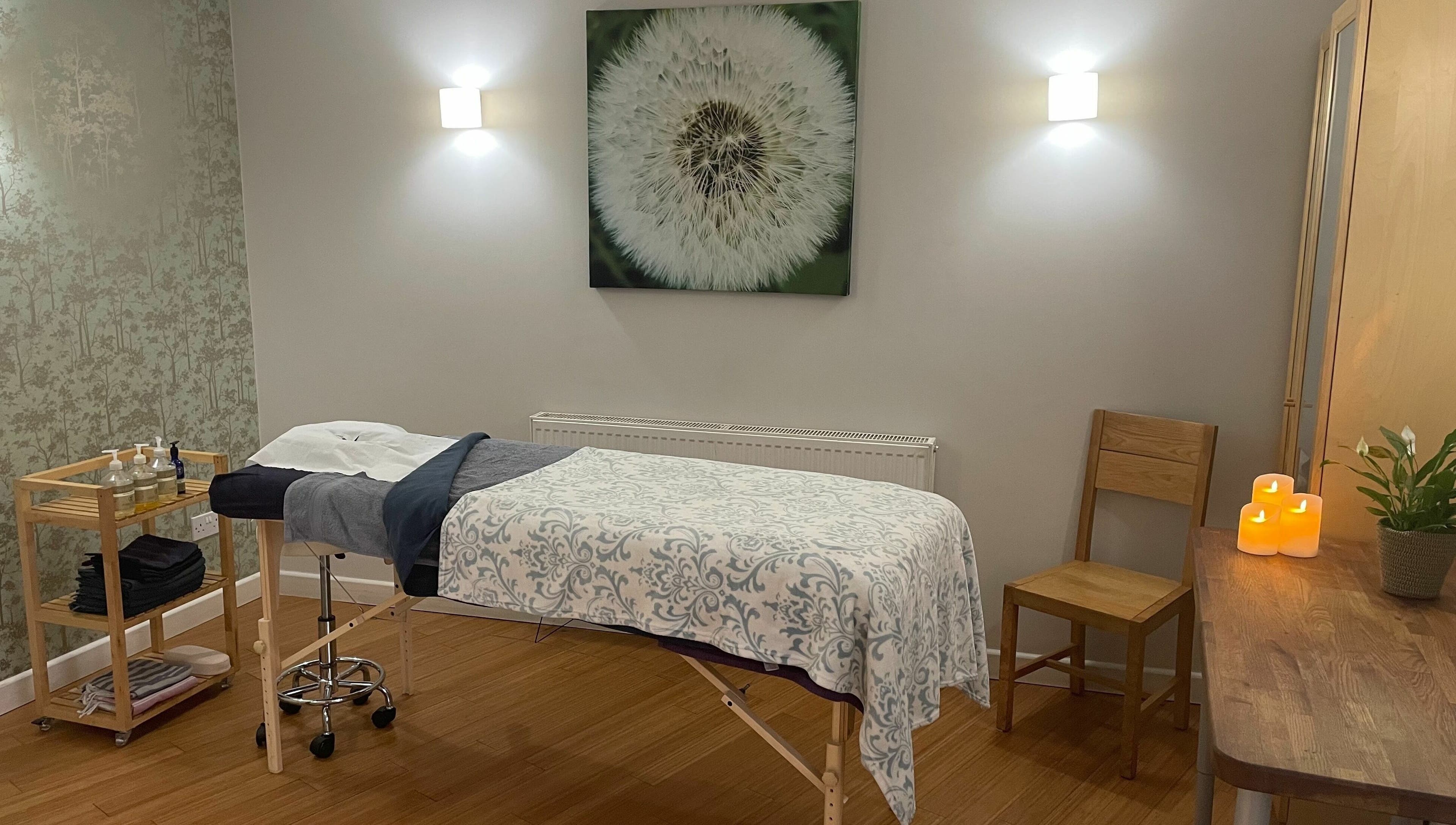 Serene massage room at Balm, Royal Leamington Spa, England. Cozy decor with calming ambiance.