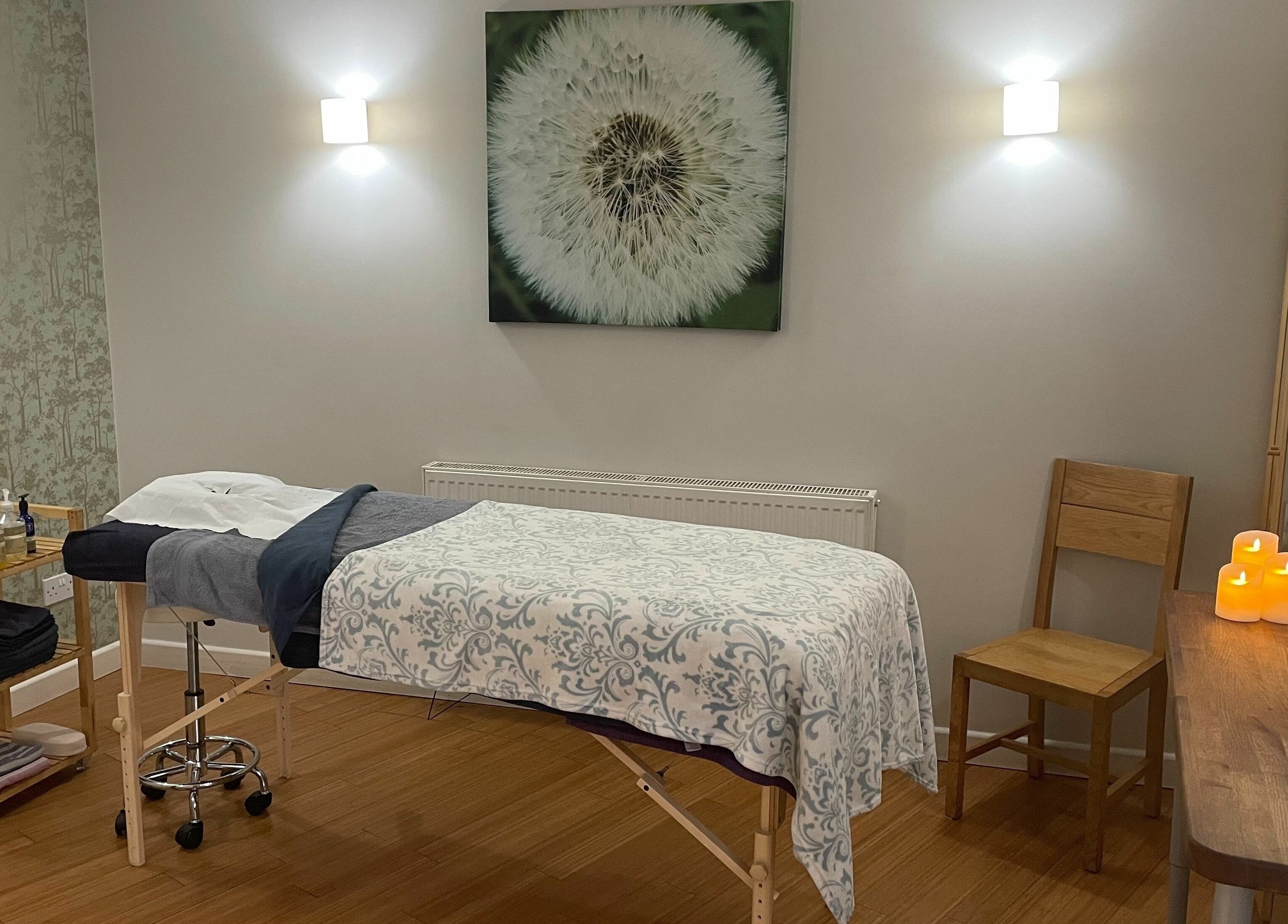 Serene massage room at Balm, Royal Leamington Spa, England. Cozy decor with calming ambiance.