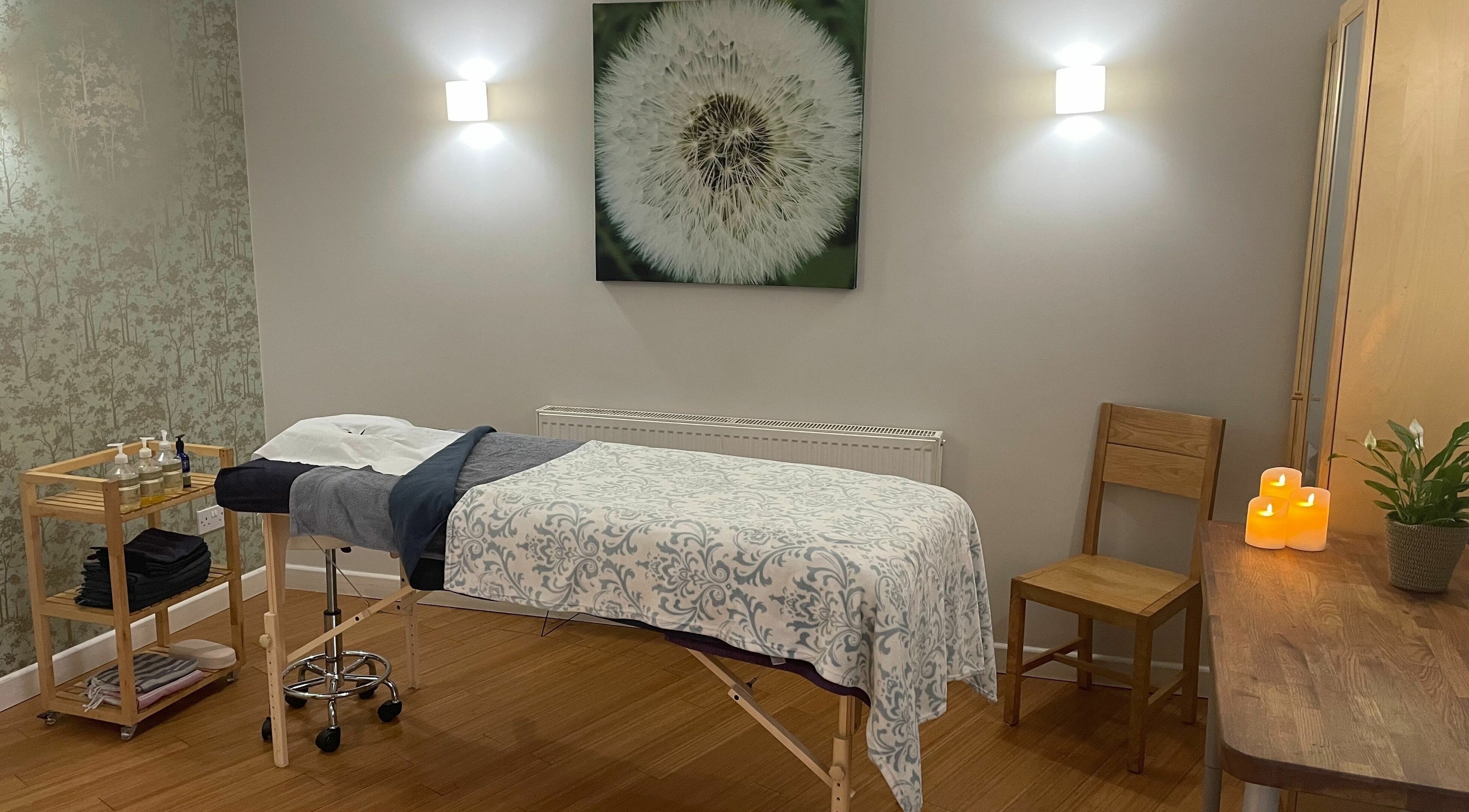 Serene massage room at Balm, Royal Leamington Spa, England. Cozy decor with calming ambiance.