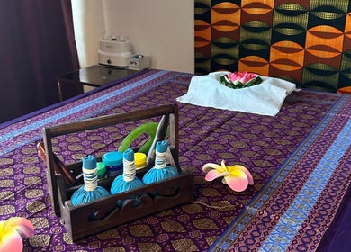 Relaxing massage area at Blue Bamboo Thai Massage & Spa, Basel, Basel-stadt, CH, featuring vibrant decor.
