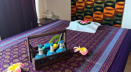 Relaxing massage area at Blue Bamboo Thai Massage & Spa, Basel, Basel-stadt, CH, featuring vibrant decor.