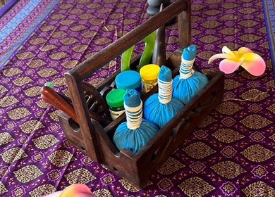 Spa essentials at Blue Bamboo Thai Massage & Spa, Basel, Basel-stadt, CH, on a vibrant patterned mat.