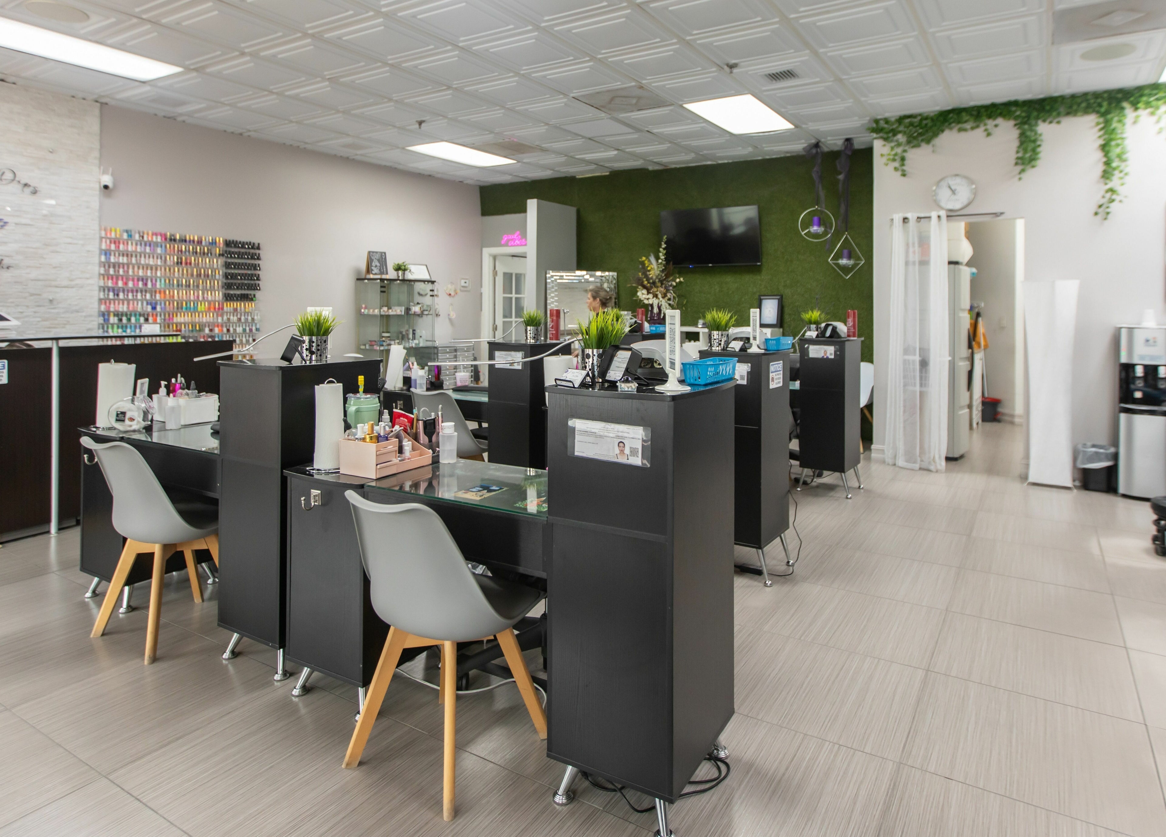 Modern interior of Tips & Dips Nail Studio in Doral, Florida, US, showcasing stylish nail bar setup.